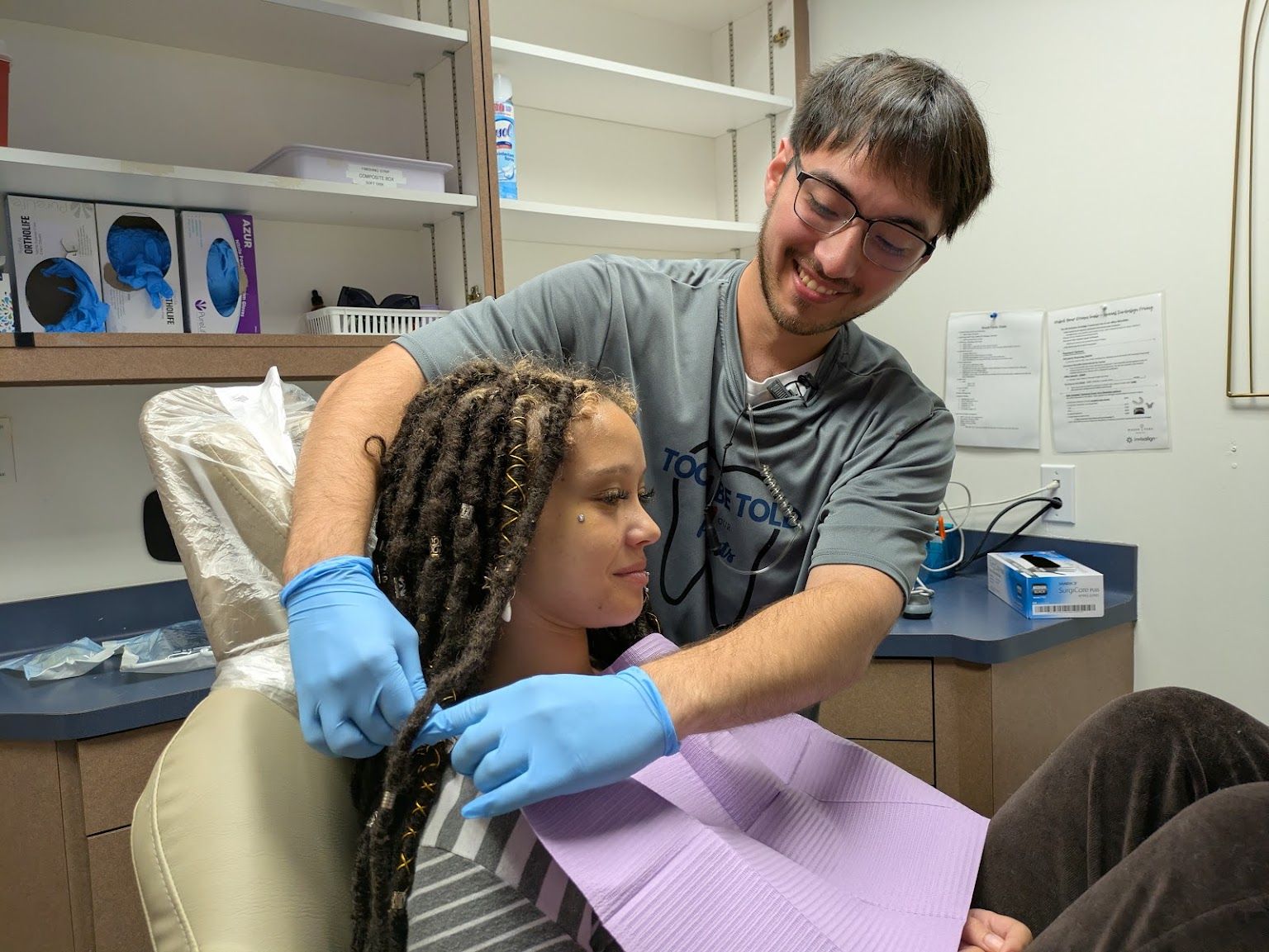 A young patient in the chair with the dentist