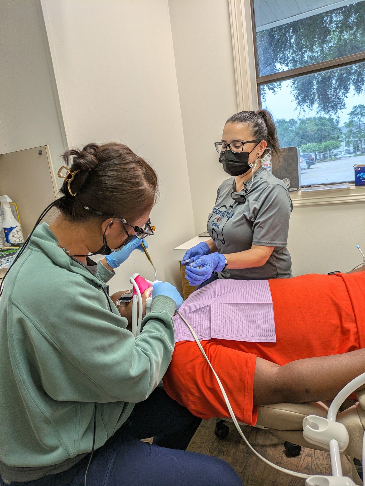 A hygienist in the pediatric treatment room