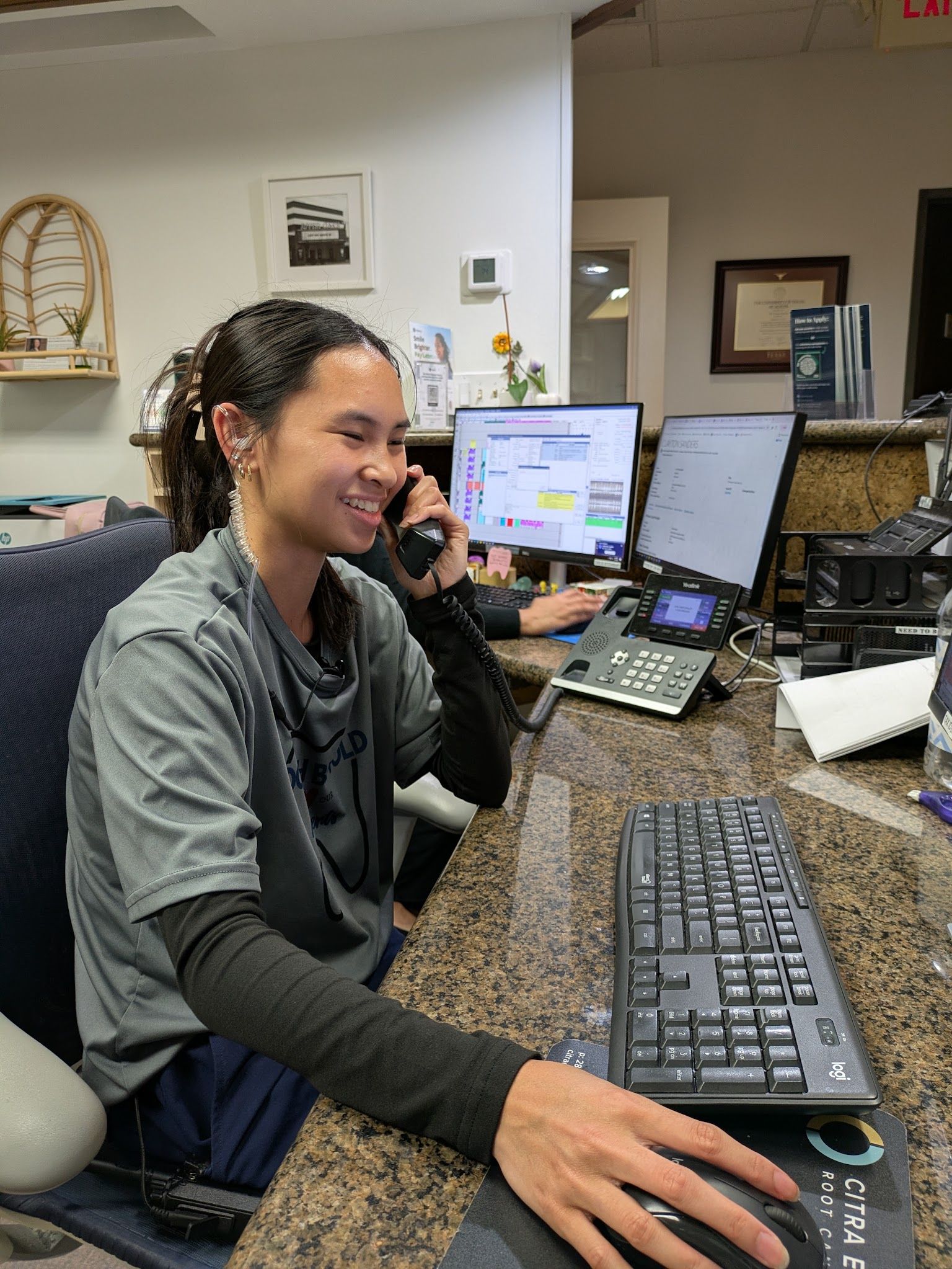 The front desk on the phone with a patient