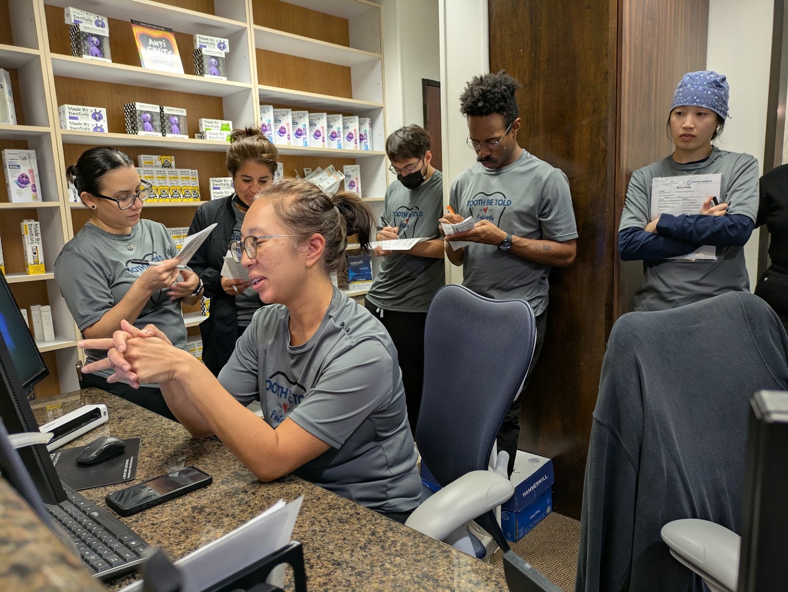 The front desk going over the morning's list with the clinical team