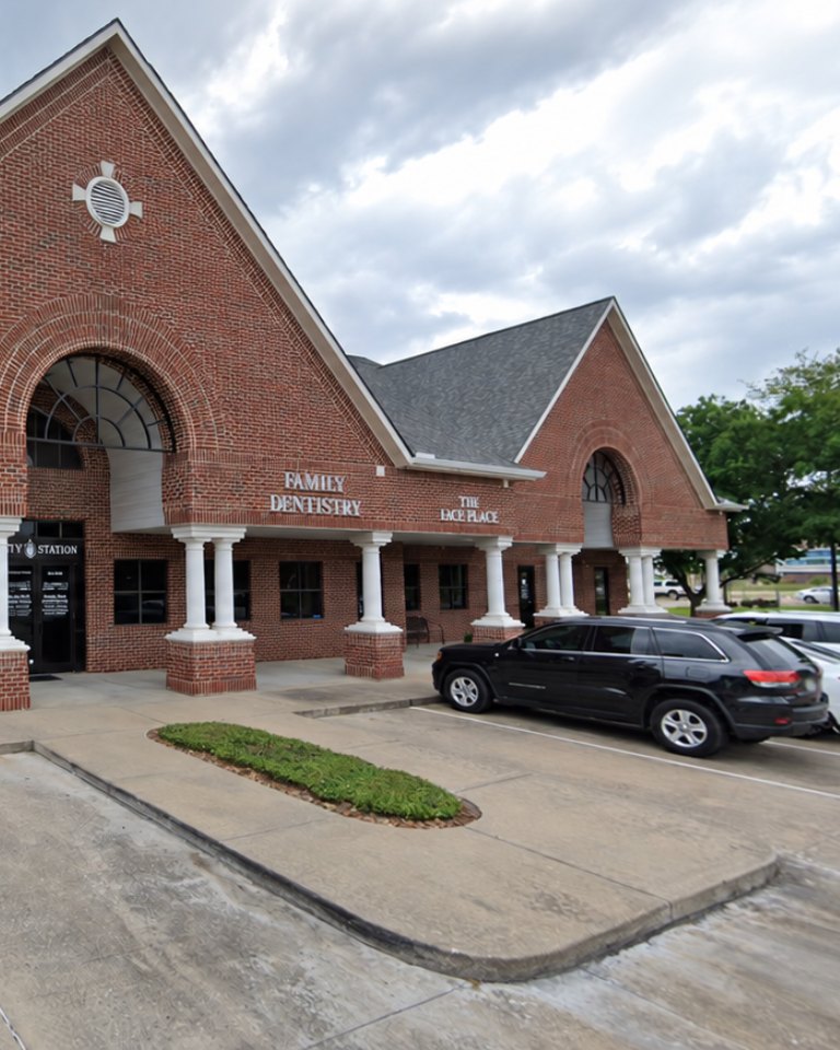 The brick building on Kingsland Blvd with its columned walkway and the Family Dentistry sign
