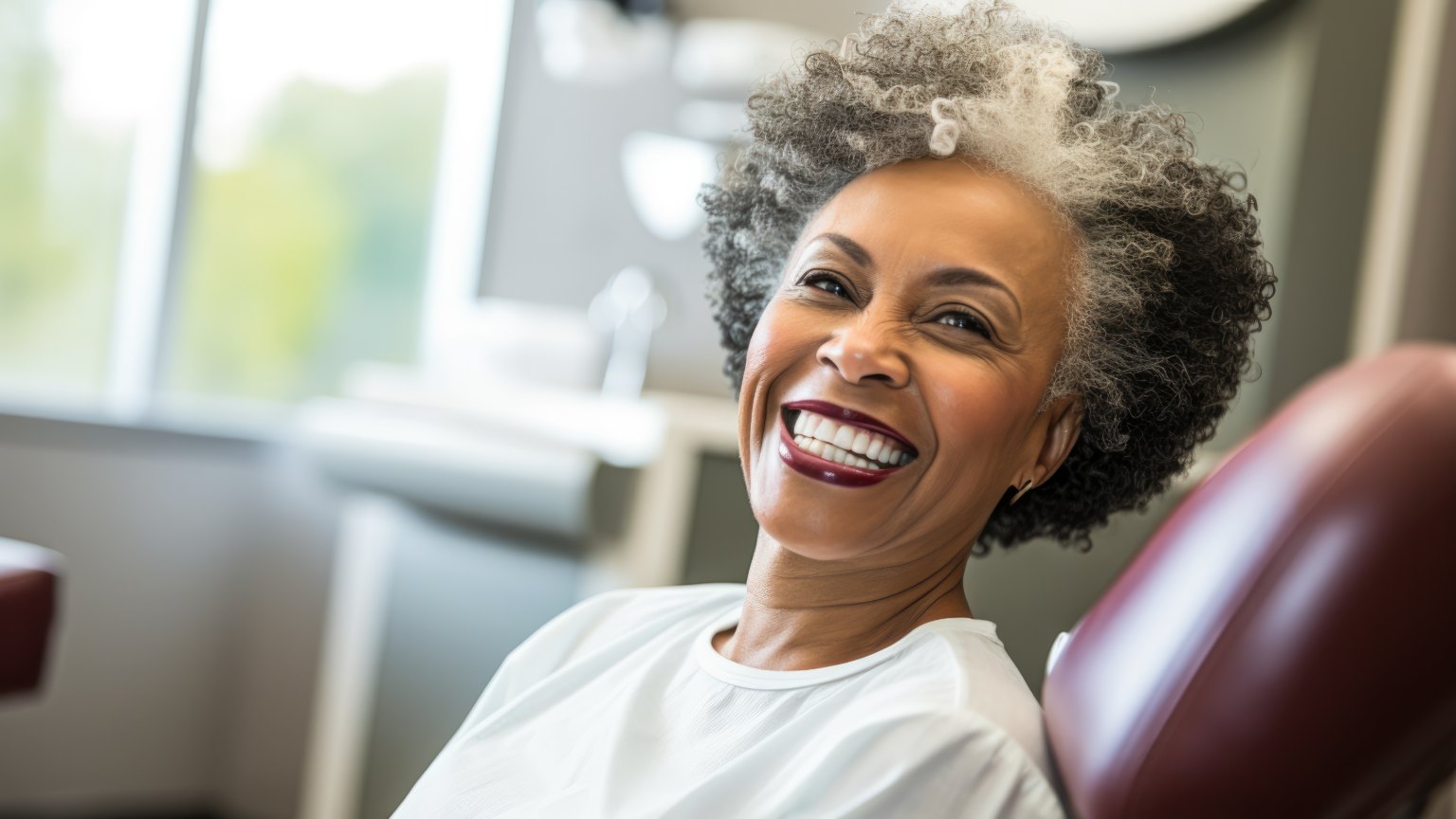 A patient laughing in the dental chair